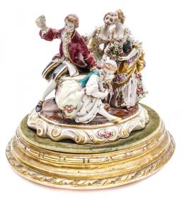 547 - GRUPO EN PORCELANA "FIGURAS EN TORNO A LA MESA"
