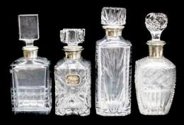 30 - CUATRO BOTELLAS LICORERAS EN CRISTAL Y PLATA