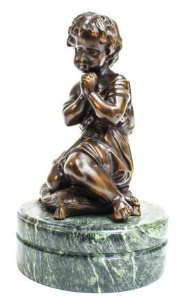 778 - FIGURA EN BRONCE "NIÑO SOBRE COJÍN"