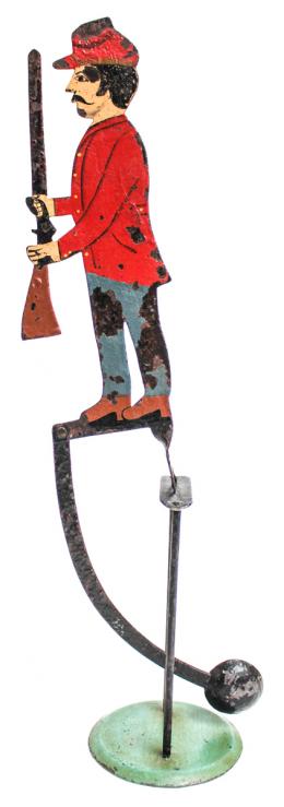 194 - FIGURA DE "TENTETIESO" EN METAL