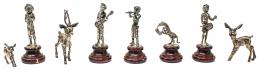 1057 - COLECCIÓN DE OCHO FIGURITAS DE PLATA