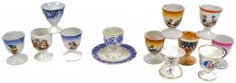 644 - COLECCIION DE 12 HUEVERAS EN PORCELANA Y LOZA