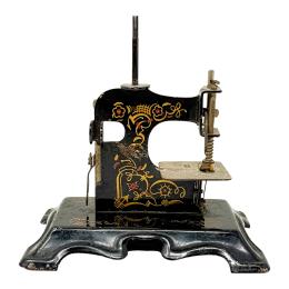 215 - MÁQUINA COSER DE JUGUETE DE PPS. DEL S.XX