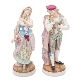 711 - PAREJA DE FIGURAS DE PORCELANA DEL SIGLO XIX