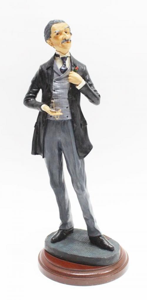 FIGURA DE COLECCIÓN INGLESA "CABALLERO CON RELOJ"