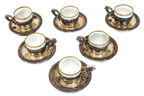 SEIS TAZAS DE PLATA CON PLATOS