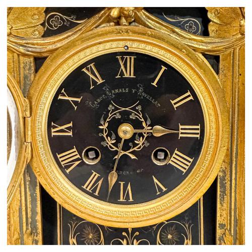 RELOJ CON GUARNICIÓN FRANCÉS ÚLTIMO TERCIO DE S. XIX